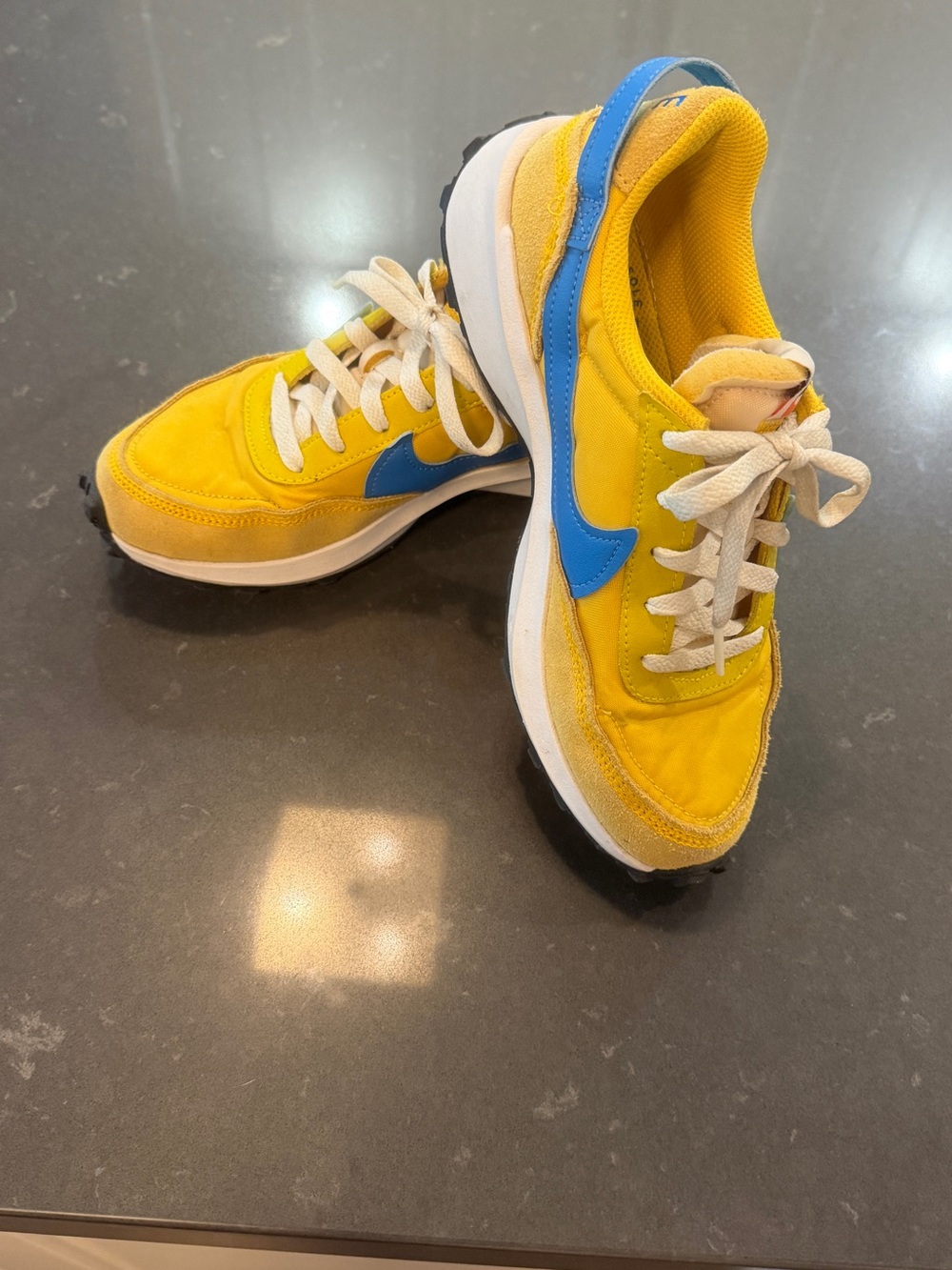 Nike women’s Yellow Sneakers with Blue Swoosh